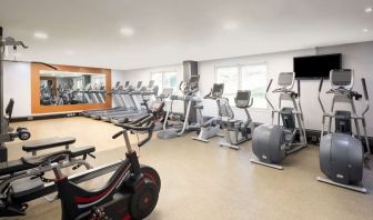 Fully equipped fitness center at Hilton London Heathrow Airport.