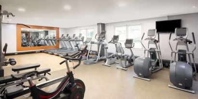 Fully equipped fitness center at Hilton London Heathrow Airport.