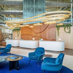 Stylish lobby and coworking lounge at Hilton London Heathrow Airport.