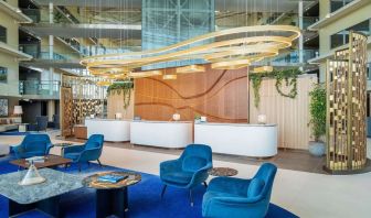 Stylish lobby and coworking lounge at Hilton London Heathrow Airport.