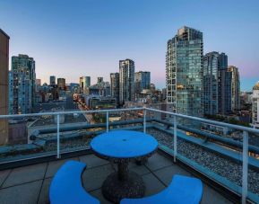 Hotel rooftop with city view at Grand Park Hotel & Suites Downtown Vancouver.