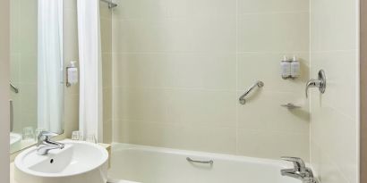 Guest bathroom with shower at  Leonardo Hotel Bradford.