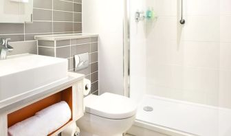 Guest bathroom with shower at Leonardo Hotel Belfast.
