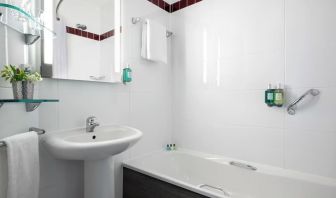 Guest bathroom with shower at Leonardo Hotel Brighton.