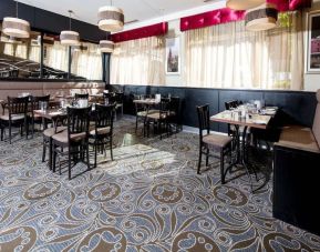 Dining area perfect for coworking at Leonardo Hotel Cork.
