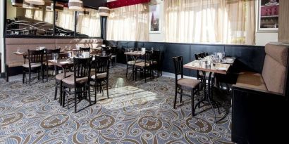 Dining area perfect for coworking at Leonardo Hotel Cork.
