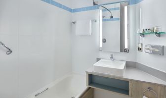 Guest bathroom with shower at Leonardo Hotel London Croydon.