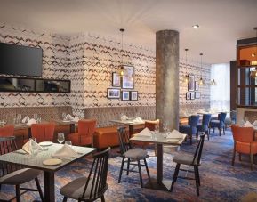 Dining area perfect for coworking at Leonardo Hotel Exeter.