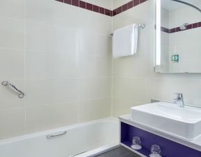 Guest bathroom with shower at Leonardo Hotel Exeter.