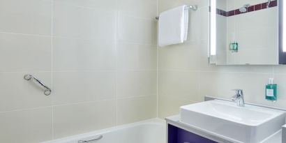 Guest bathroom with shower at Leonardo Hotel Exeter.