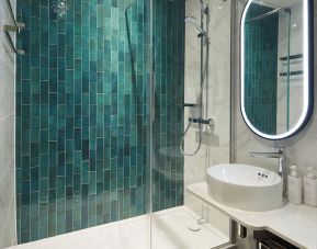 Guest bathroom with shower at Leonardo Royal Hotel Glasgow.