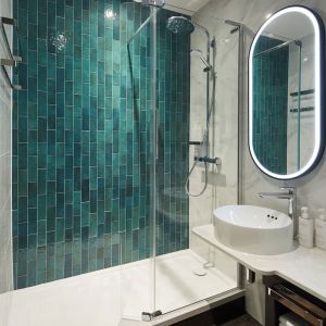 Guest bathroom with shower at Leonardo Royal Hotel Glasgow.