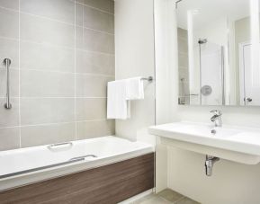 Guest bathroom with shower and tub at Leonardo Hotel And Conference Venue Hinckley Island.