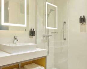 Guest bathroom with shower at Leonardo Royal Hotel Oxford.