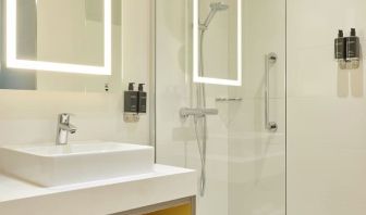 Guest bathroom with shower at Leonardo Royal Hotel Oxford.