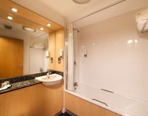 Guest bathroom with shower at Leonardo Inn Aberdeen Airport.