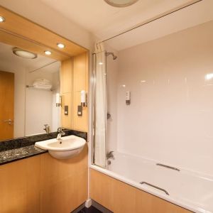 Guest bathroom with shower at Leonardo Inn Aberdeen Airport.