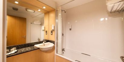 Guest bathroom with shower at Leonardo Inn Aberdeen Airport.