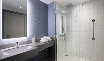 Guest bathroom with shower at Leonardo Hotel Bristol City.
