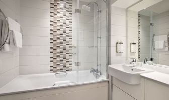 Guest bathroom with shower and tub at Leonardo Hotel Chester.