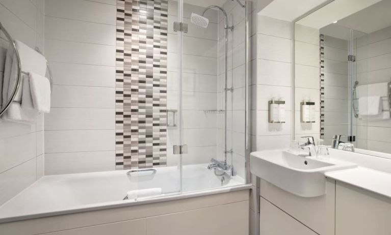 Guest bathroom with shower and tub at Leonardo Hotel Chester.