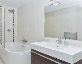 Guest bathroom with shower at Leonardo Hotel Edinburgh Murrayfield.