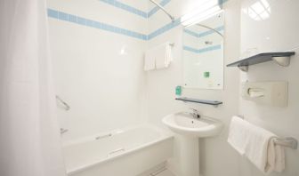 Guest bathroom with shower at Leonardo Hotel Leeds.