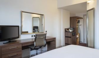 Day use room with work desk, coffee maker and cabinet at Leonardo Hotel Leeds.