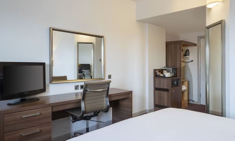 Day use room with work desk, coffee maker and cabinet at Leonardo Hotel Leeds.