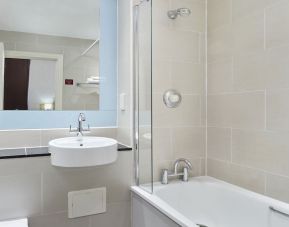 Guest bathroom with shower and tub at Leonardo Hotel Edinburgh City.