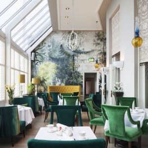 Modern dining area with high ceiling and natural light at The Grand Brighton.