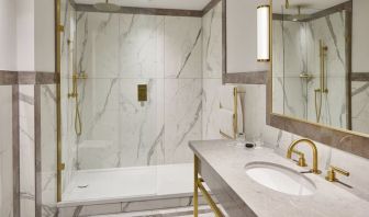 Guest bathroom with shower at The Grand Brighton. 