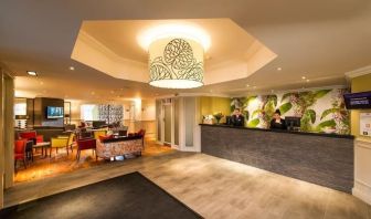 Reception and coworking lounge at Leonardo Inn Glasgow West End. 