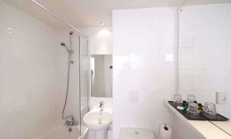 Guest bathroom with shower at Leonardo Inn Glasgow West End. 