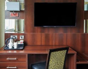 Day use room amenities like TV and coffee maker at Leonardo Inn Glasgow West End.