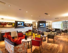 Lobby and coworking lounge at Leonardo Inn Glasgow West End. 