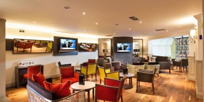 Lobby and coworking lounge at Leonardo Inn Glasgow West End. 