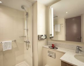 Guest bathroom with shower at Leonardo Hotel London Heathrow Airport.