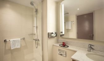 Guest bathroom with shower at Leonardo Hotel London Heathrow Airport.