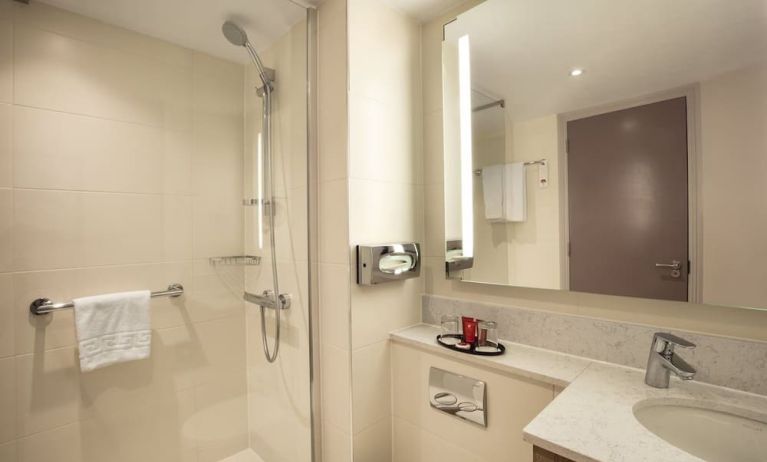 Guest bathroom with shower at Leonardo Hotel London Heathrow Airport.