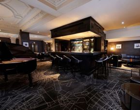 Stylish hotel bar with piano at The Dilly.  