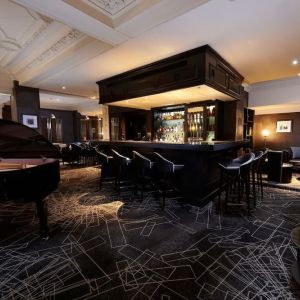 Stylish hotel bar with piano at The Dilly.  