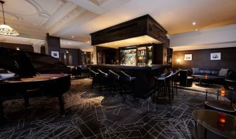 Stylish hotel bar with piano at The Dilly.  