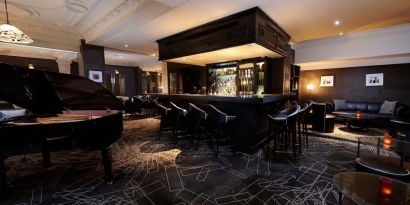 Stylish hotel bar with piano at The Dilly.  