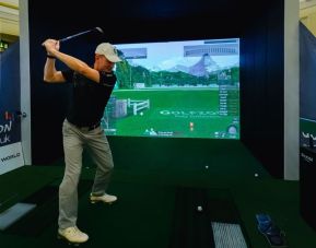 Indoor golf driving range available at The Dilly.  