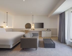 Spacious day use room with sofa at Leonardo Hotel Manchester Piccadilly. 