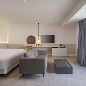 Spacious day use room with sofa at Leonardo Hotel Manchester Piccadilly. 