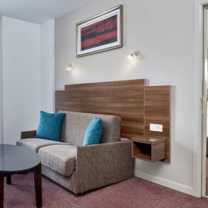 King suite with lounge at Leonardo Hotel Newcastle.