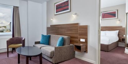 King suite with lounge at Leonardo Hotel Newcastle.