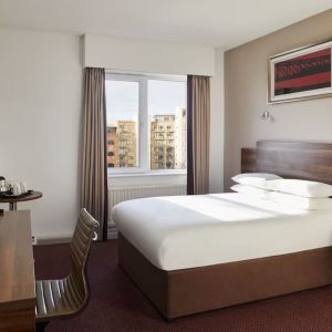 King bed with natural light at Leonardo Hotel Newcastle.